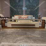 Architectural TV Stand with Sculpted Relief Panels Natural Wood Veneer Open Display Shelves and Soft Ambient Lighting